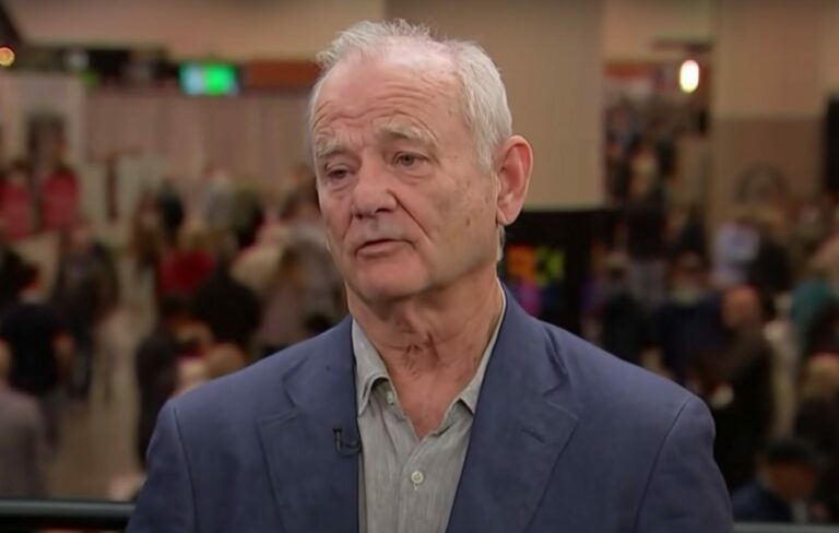 Bill Murray wears a blue suit in a TV interview with CNBC