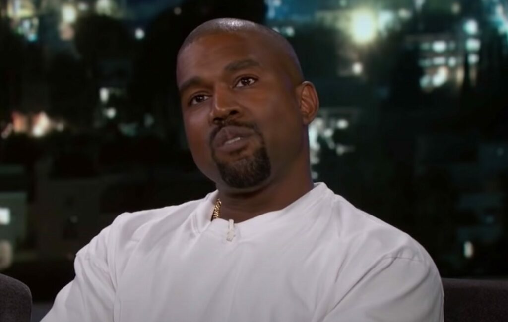 Kanye West wears a white t-shirt on the Jimmy Kimmel Show