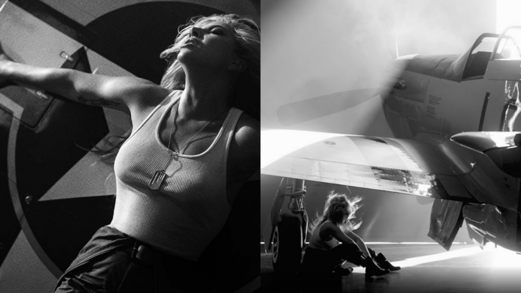Lady Gaga wears a white vest and sits beneath an airplane in a black and white Top Gun teaser
