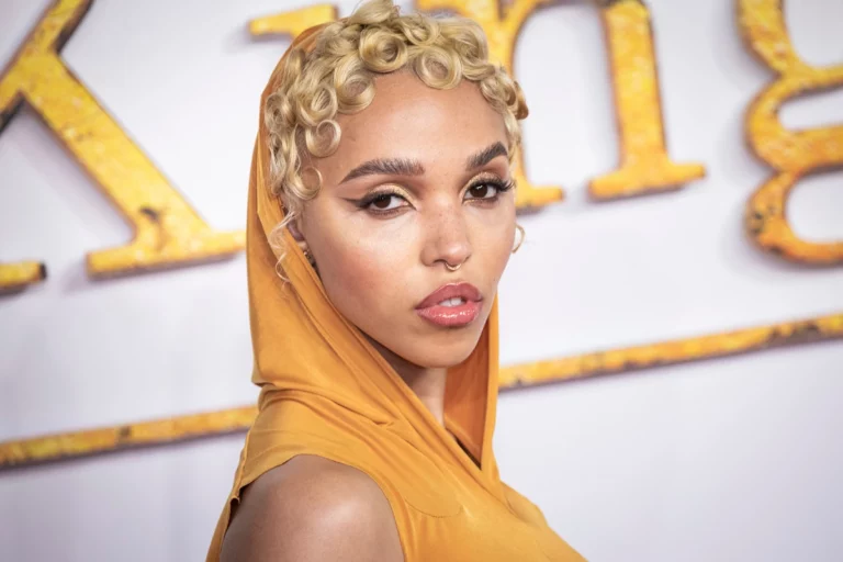 FKA Twigs poses for photographers at the World premiere of the film 'The King's Man' in London Monday, Dec. 6, 2021.