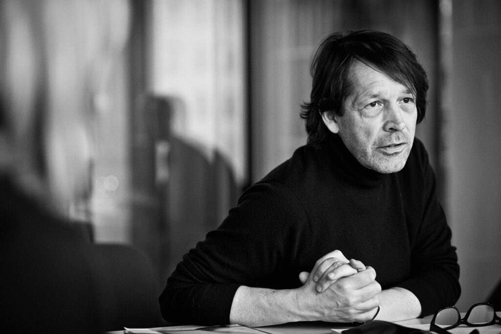 A photograph of artist Peter Saville