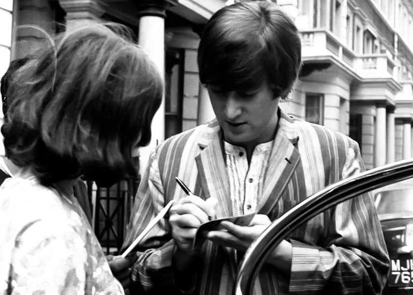 John Lennon meets a fan on Saville Row (Picture: Tommy Hanley/Yoko Ono)