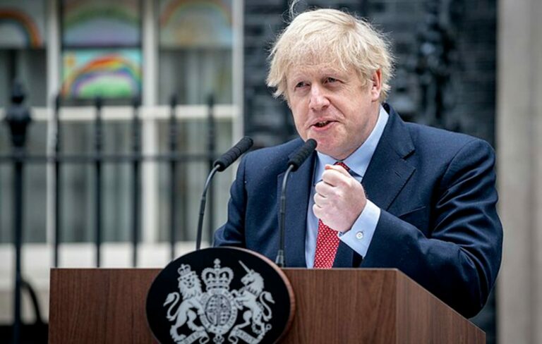 Boris Johnson speaks at the lectern outside 10 Downing Street