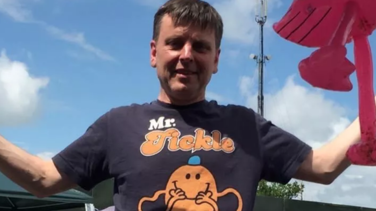 Nigel Stonehouse wears a Mr Tickle shirt with his arms outstretched