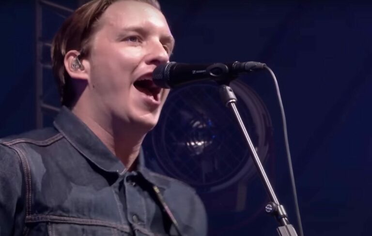 George Ezra perform live at Glastonbury in a denim jacket