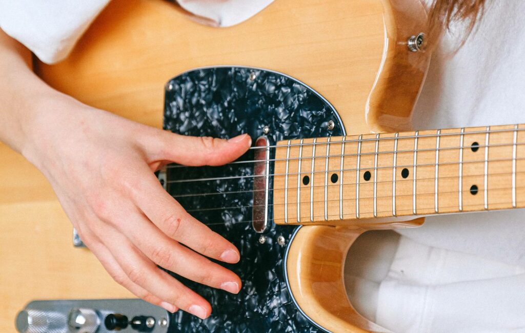 A woman plays guitar (Picture: Pexels)
