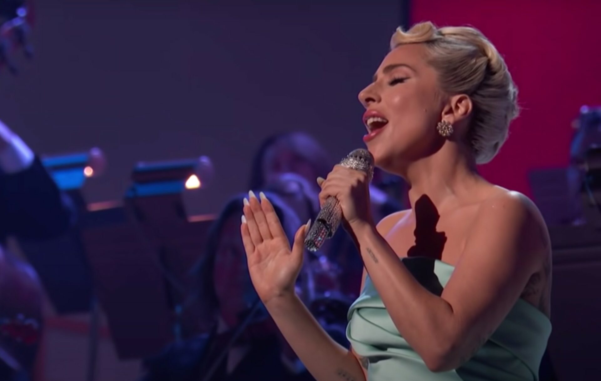 Lady Gaga performs live at the 64th Grammy Awards in a blue strapless gown