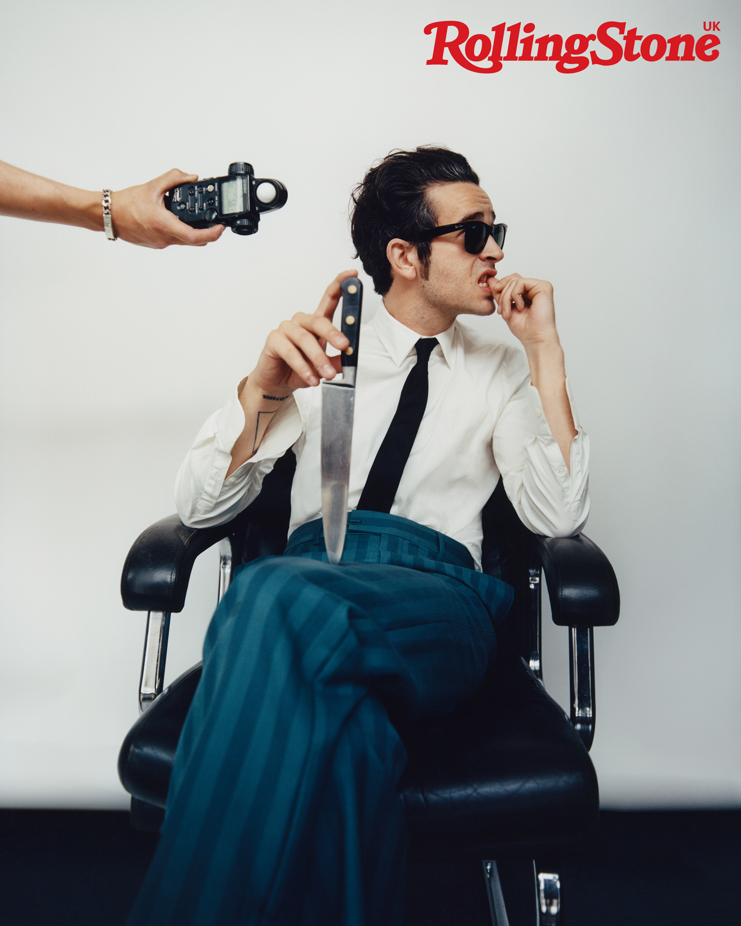 The 1975’s Matty Healy photographed for the cover of Rolling Stone UK. Matty wears vintage shirt by Prada, vintage tie, Matty’s own, trousers by Louis Vuitton, shoes by John Lobb and sunglasses by Ray-Ban