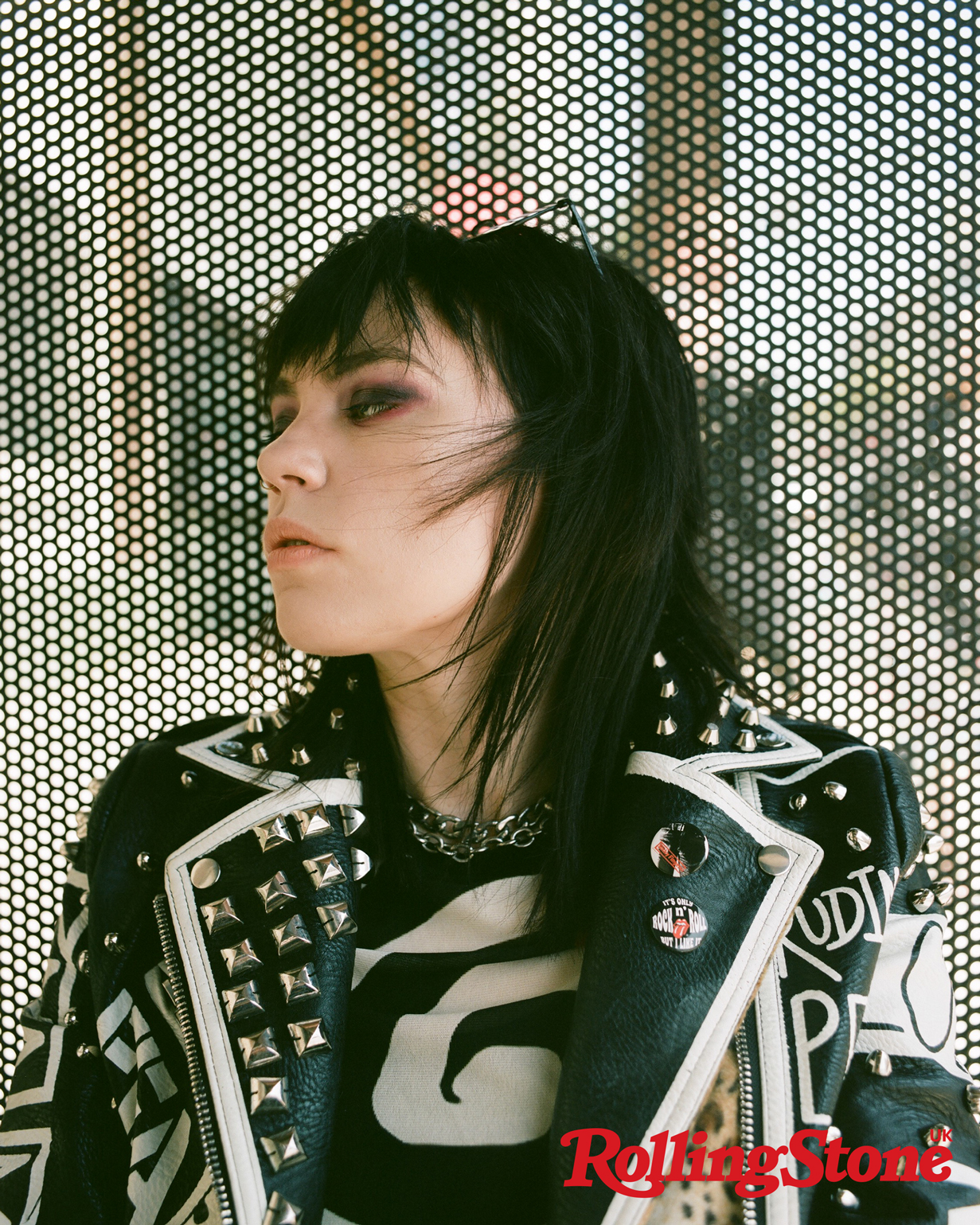 Han Mee of Hot Milk poses for a close up headshot, wearing a black leather jacket