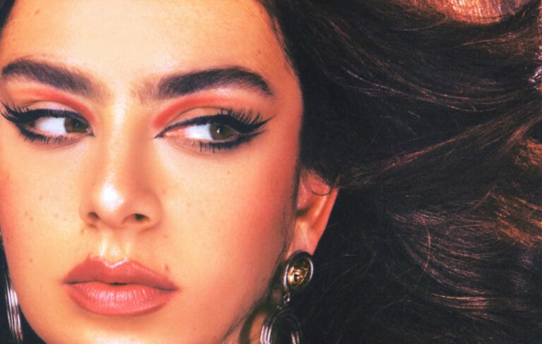 Charli XCX looks to the right in a close up shot