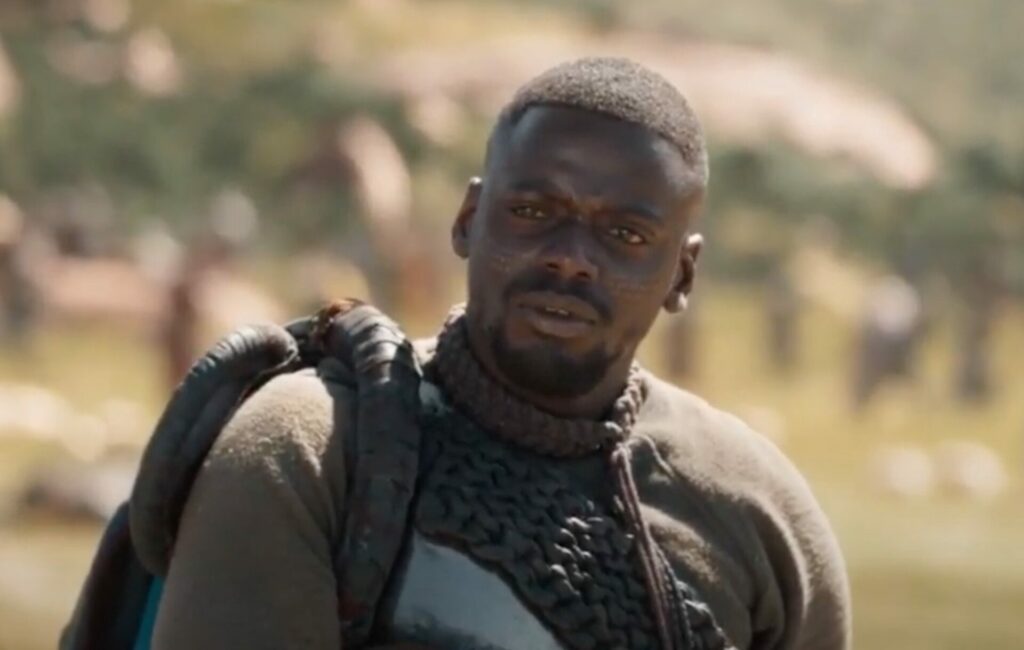 Daniel Kaluuya wears a khaki jumper in "A Lover's Fight" scene in 'Black Panther'