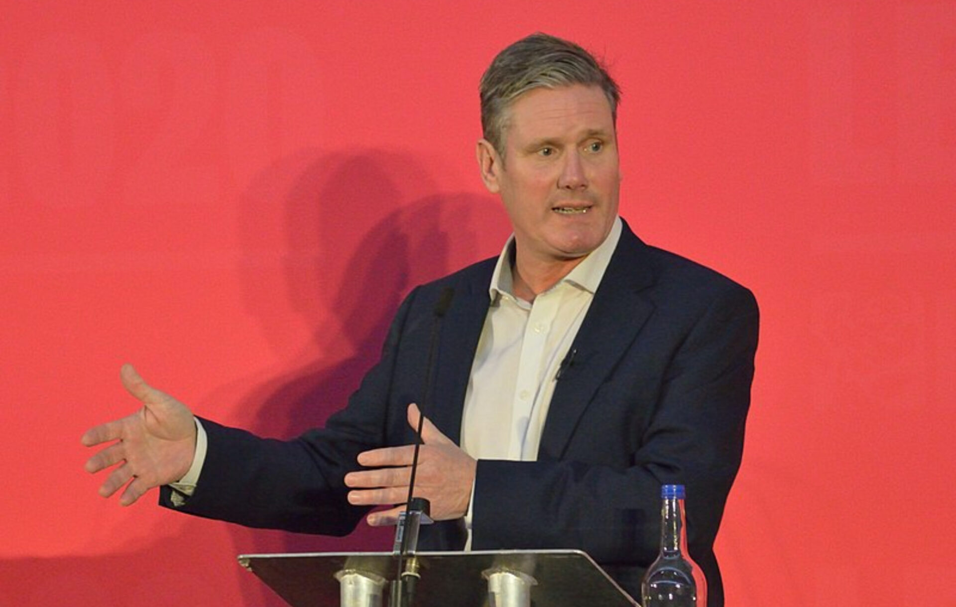 Labour leader Keir Starmer standing at a podium in 2020