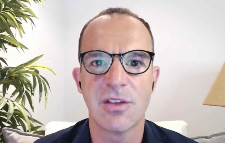 Martin Lewis wears glasses in a headshot framed interview