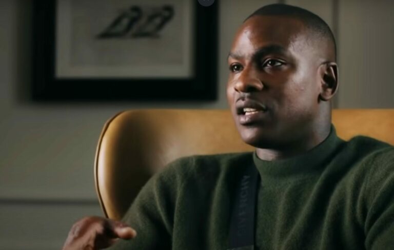 Skepta Wears a green jumper in a Vogue 'In The Bag' YouTube Video