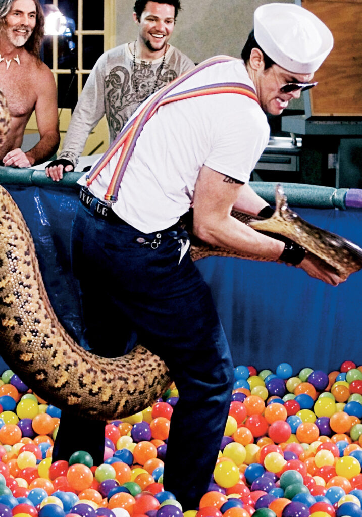 Johnny Knoxville wrestles a snake