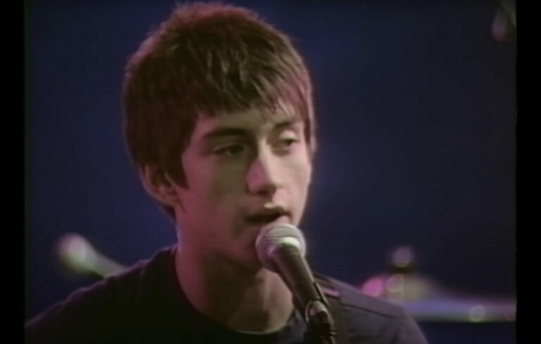 a still of Alex Turner in the official video for Arctic Monkeys' debut single 'I Bet You Look Good On The Dancefloor'