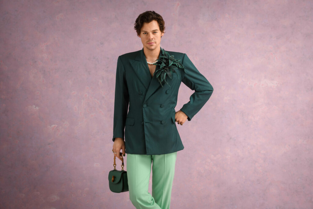 Harry Styles Madame Tussauds waxwork in a green blazer and trousers