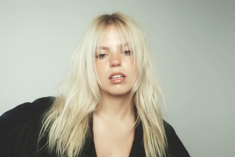Reneé Rapp masters self-sabotage on new single ‘Talk Too Much’