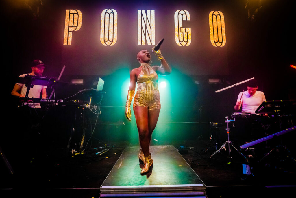 Pongo sings onstage