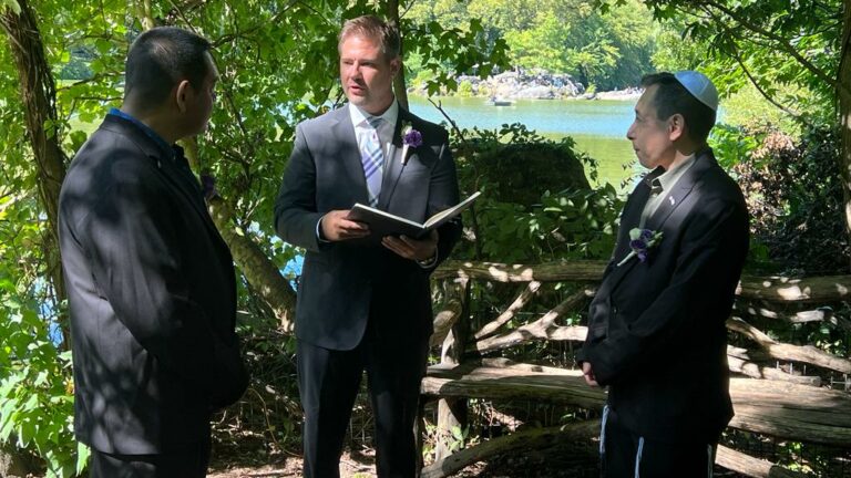 Two men take part in a wedding ceremony in Central Park