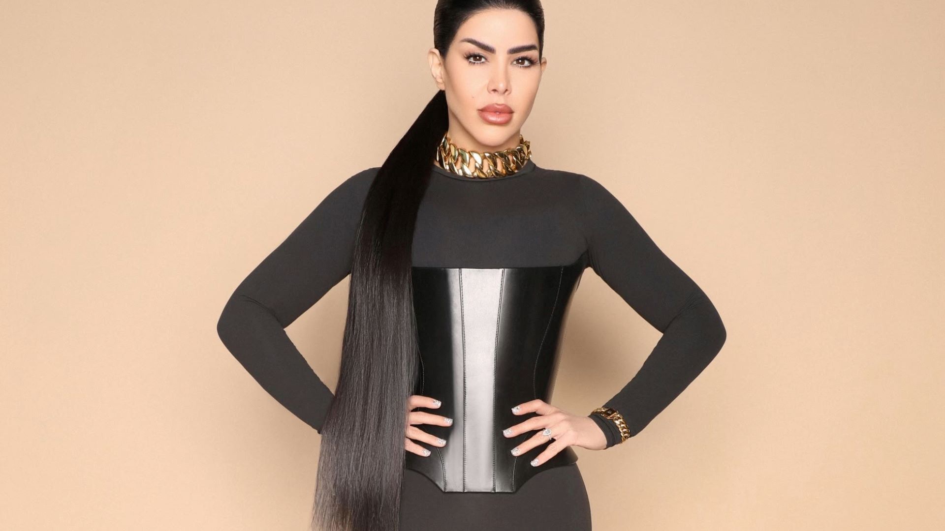 Close up shot of a woman with long black hair and a black corset