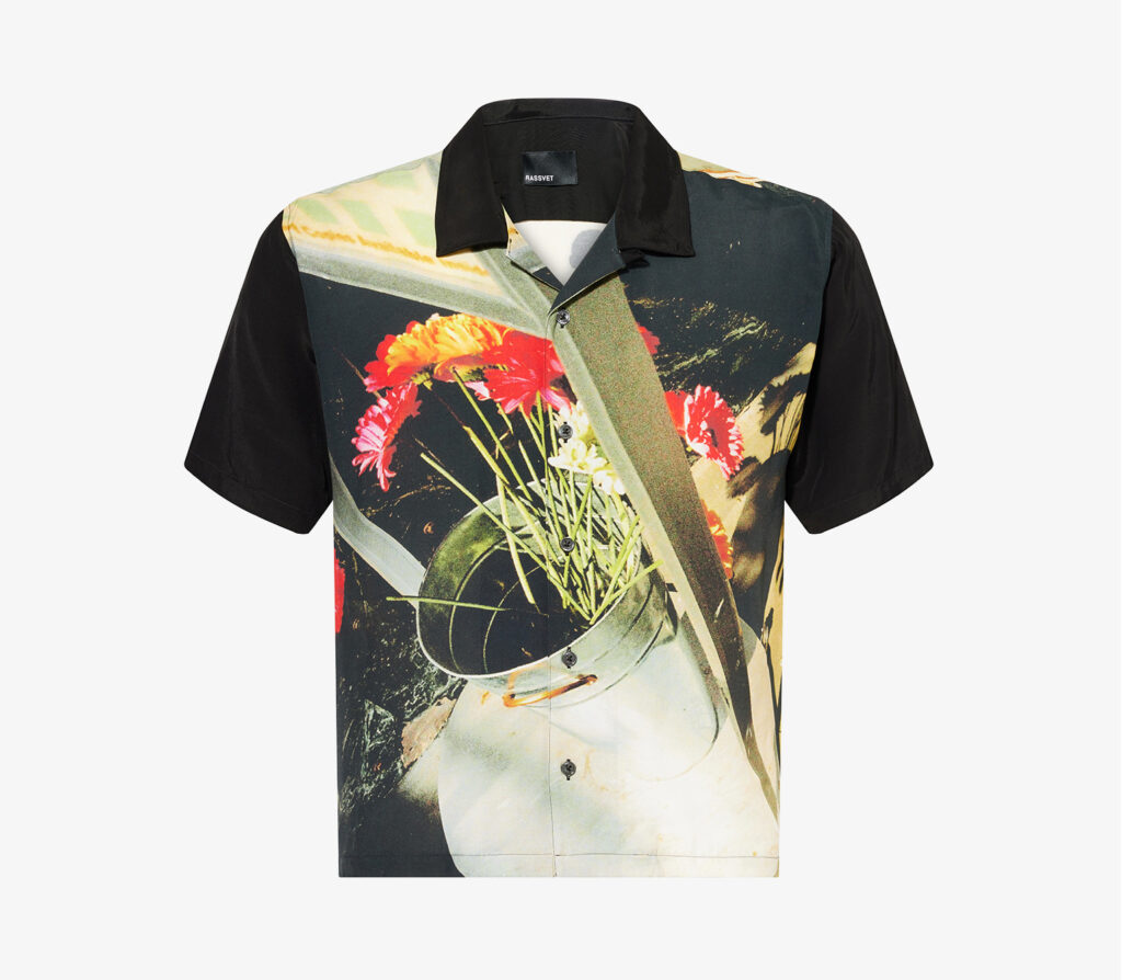 Black printed short sleeve shirt with a photo print of flowers in a silver pot
