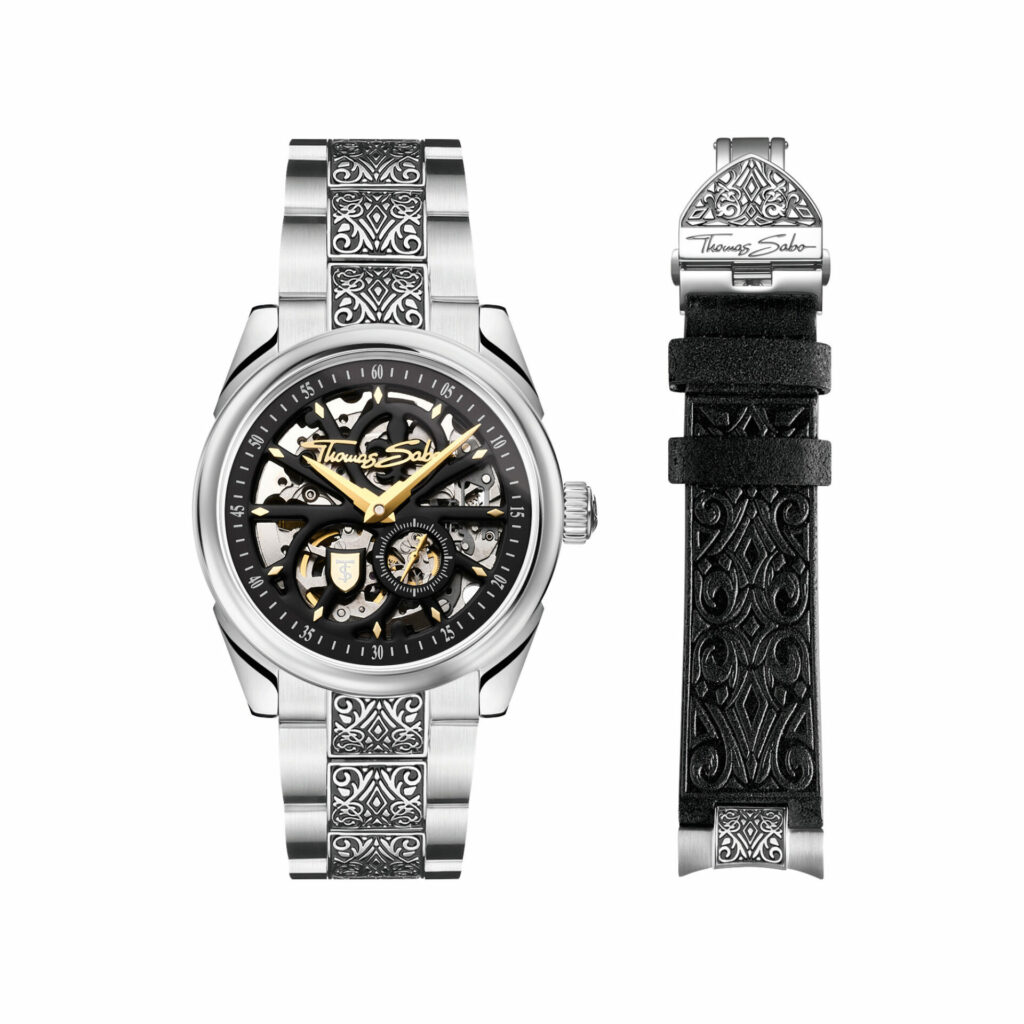 Men's silver watch with Acanthus pattern on links, black dial and silver and gold details. On the right is an alternative black leather strap with Acanthus pattern.