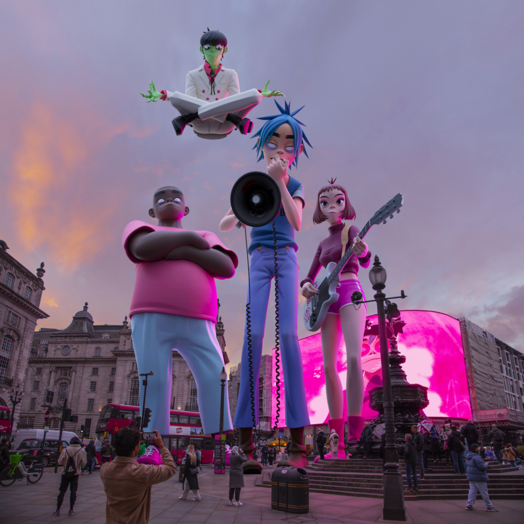 The members of Gorillaz stand high above London's Piccadilly Circus