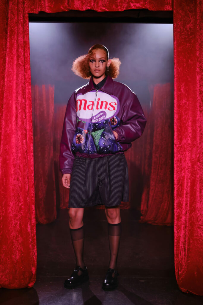 A model walks the MAINS Season 3 runway show by Skepta in Shoreditch as part of London Fashion Week wearing a Ribena-inspired leather jacket