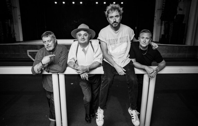 The members of Babyshambles pose on a barrier at the Brixton Academy