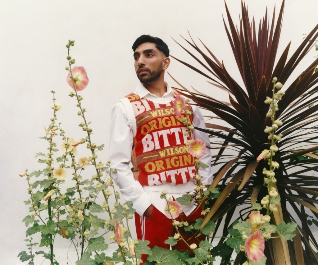 Mawaan Rizwan posing for a photoshoot amongst plants