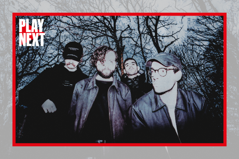 The band SCALER pose for the camera in the woods at dusk