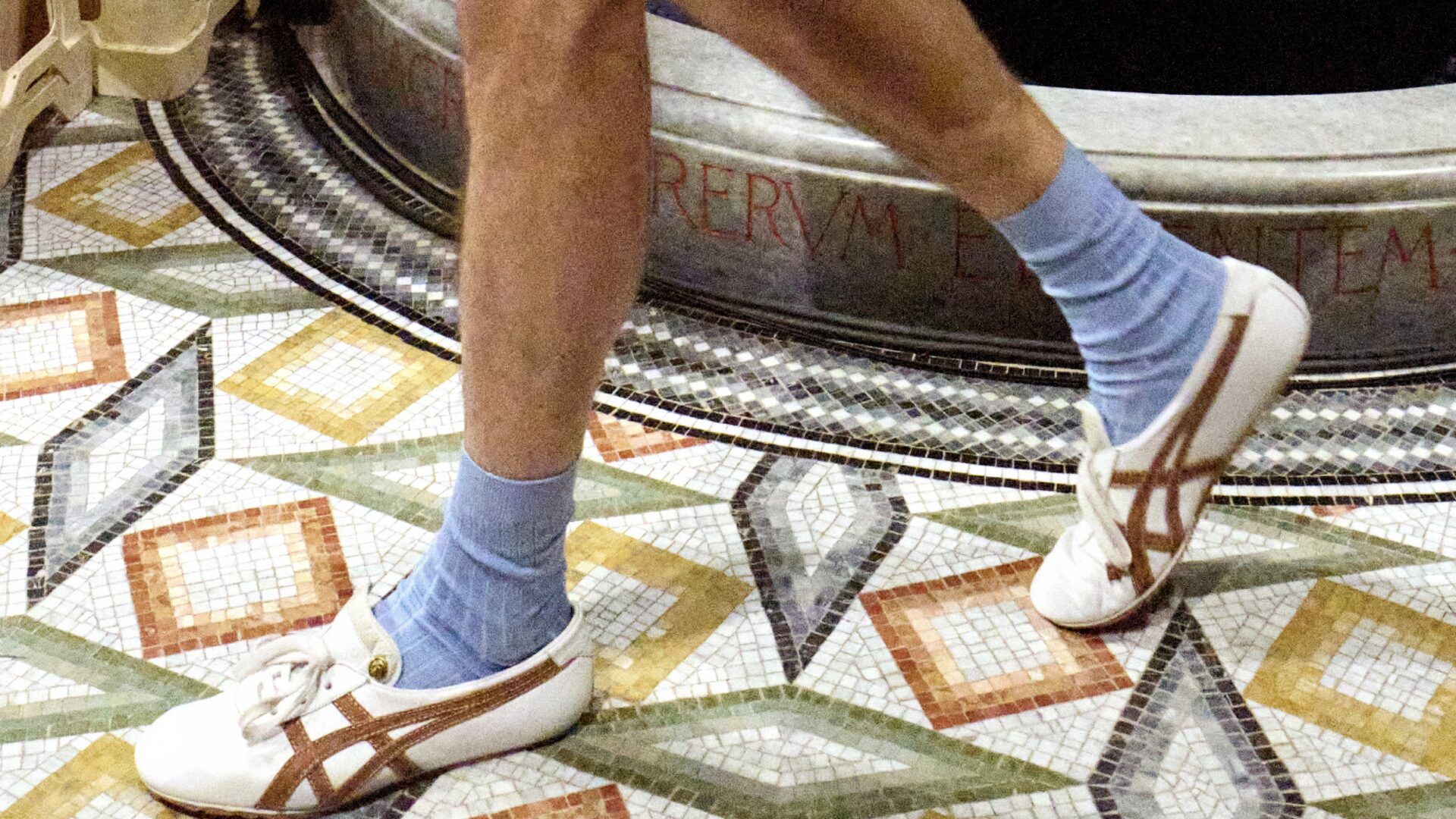 A close-up shot of the Versace x Onitsuka Tiger trainer at the Versace Spring/Summer 2026 runway show in Milan