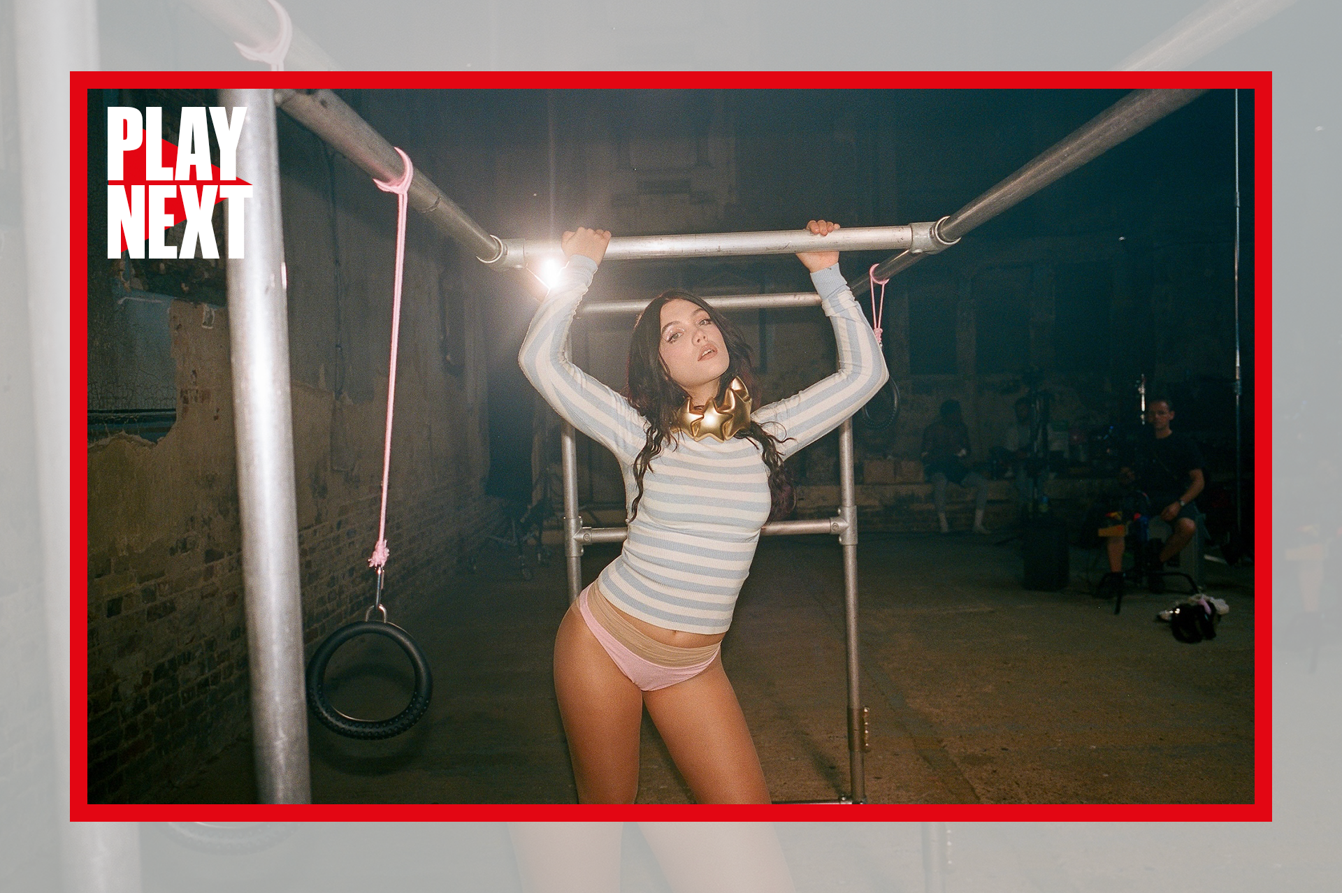 Alessi Rose posing for a photoshoot on scaffolding