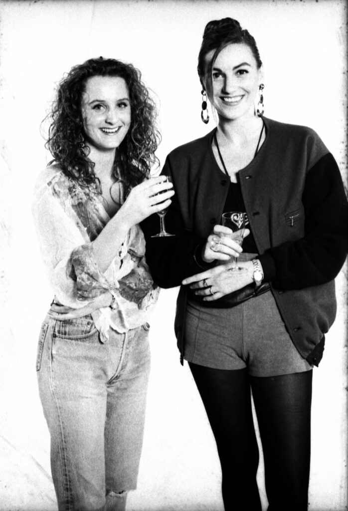 A black-and-white portrait photograph of two ravers