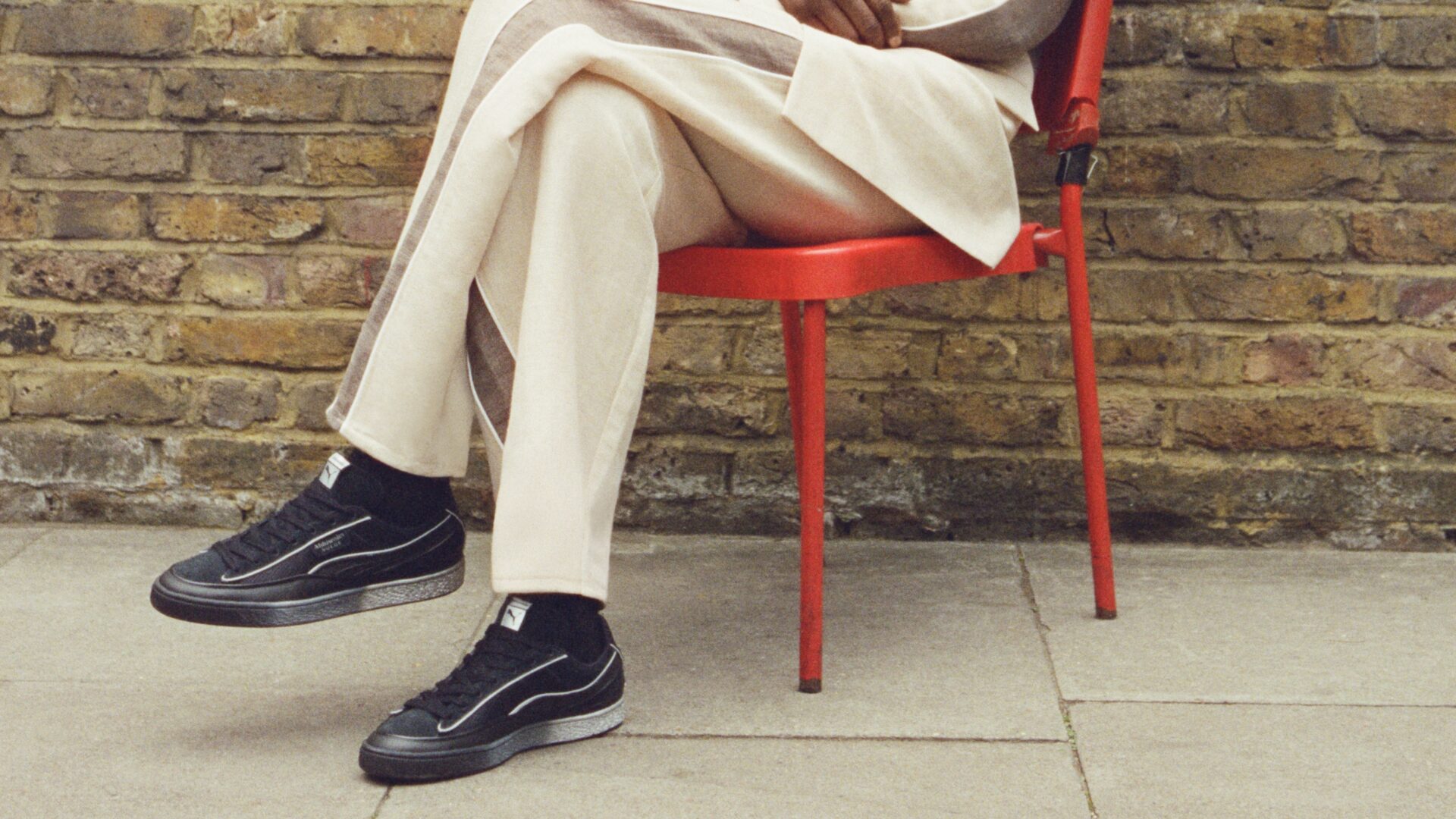 A lifestyle shot of the Ahluwalia x Puma Suede trainers.