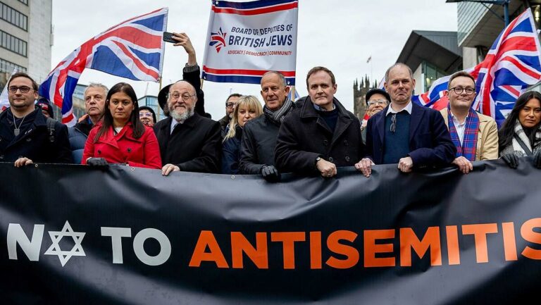 ChatGPT said: Security Minister Tom Tugendhat joins a march against antisemitism in Manchester on 21 January 2024