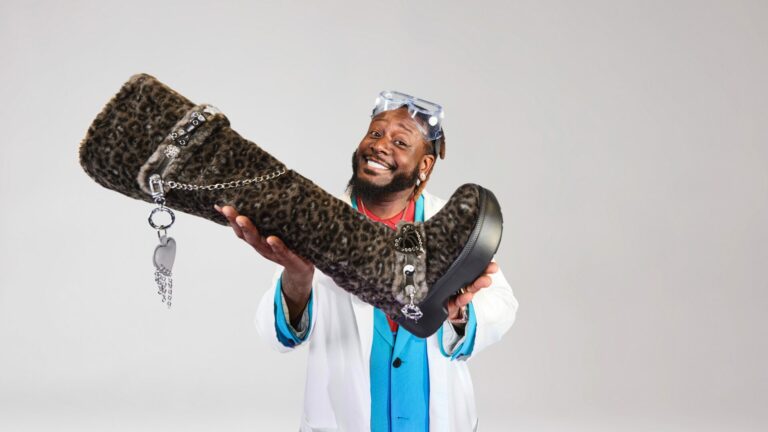 Rapper T-Pain with Crocs' new Classic Unforgettable Leopard Knee High Boot as a nod to his lyrics "boots with the fur"