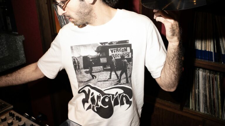 Lifestyle shot of the Virgin and Choose Love "Remastered" collection charity T-shirts