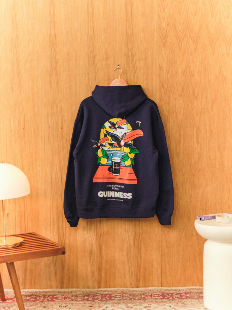 A toucan printed hoodie from the UN:IK collaboration with Guinness. 