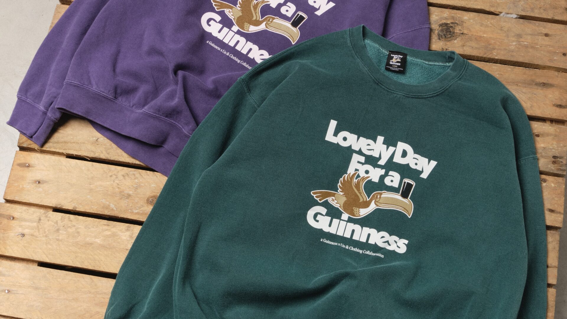 Close-up of two crewnecks from the UN:IK Guinness collaboration.