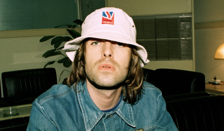 Archival photo of Liam Gallagher wearing Clarks Originals bucket hat