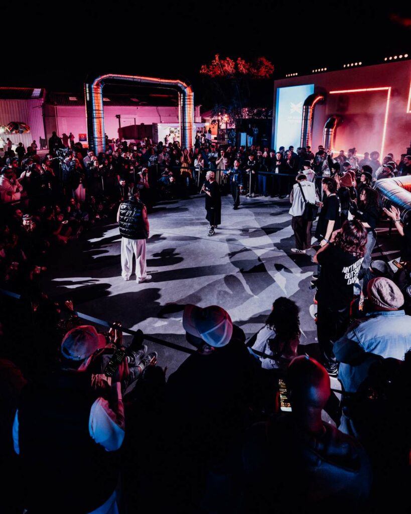 A group of performers surrounded by a crowd at Riyadh Music Week 2025