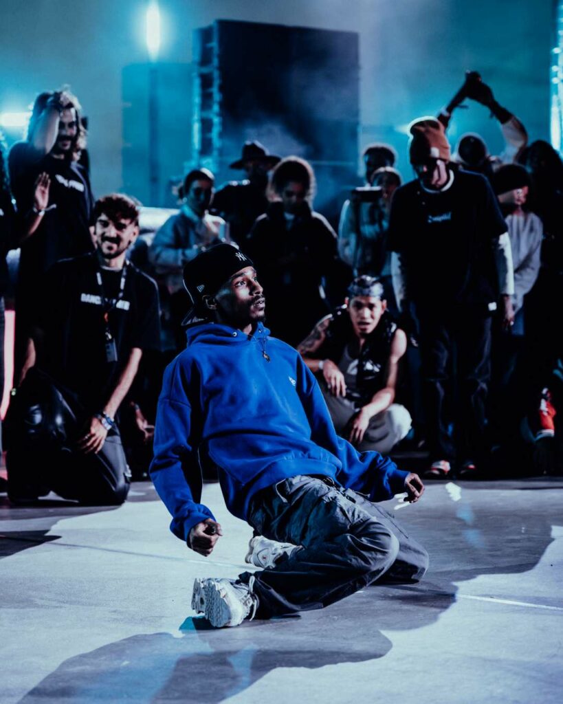 A dancer performing in front of a crowd at Riyadh Music Week 2025