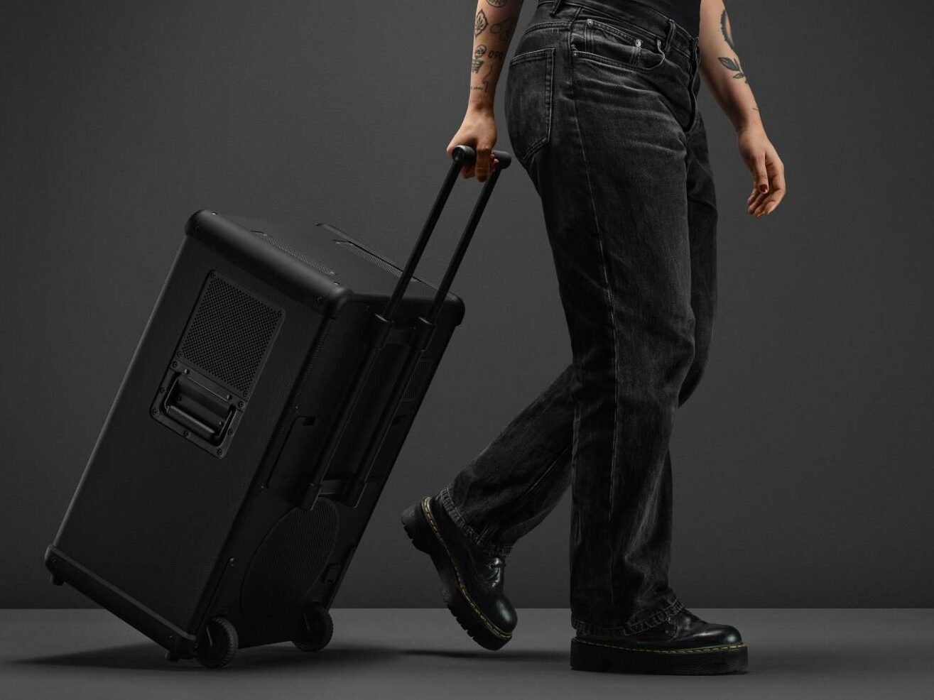 A close shot of the Marshall Bromley 750 showing a person carrying it by its handle 