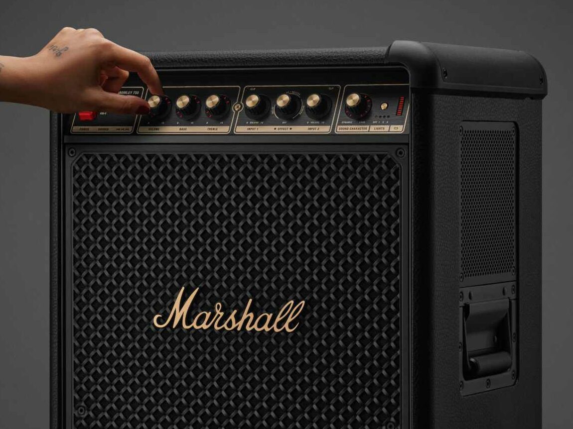 A close shot of the Marshall Bromley 750 showing a hand controlling the audio dials