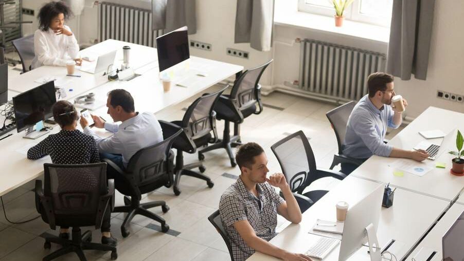 A group of people sitting in an office