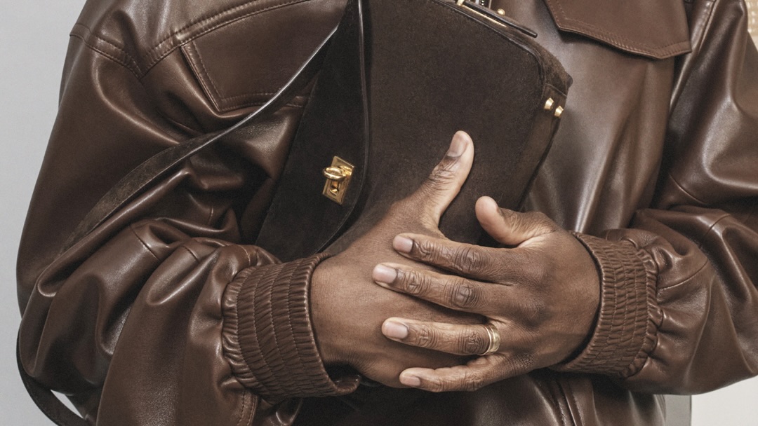 Close up of a leather jacket and suede bag from the Balenciaga Heart and Body campaign shot by David Sims