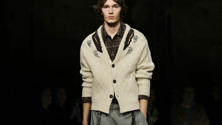 Runway shot of a male model walking Simone Rocha Autumn/Winter 2026 runway show at Alexandra Palace during London Fashion Week