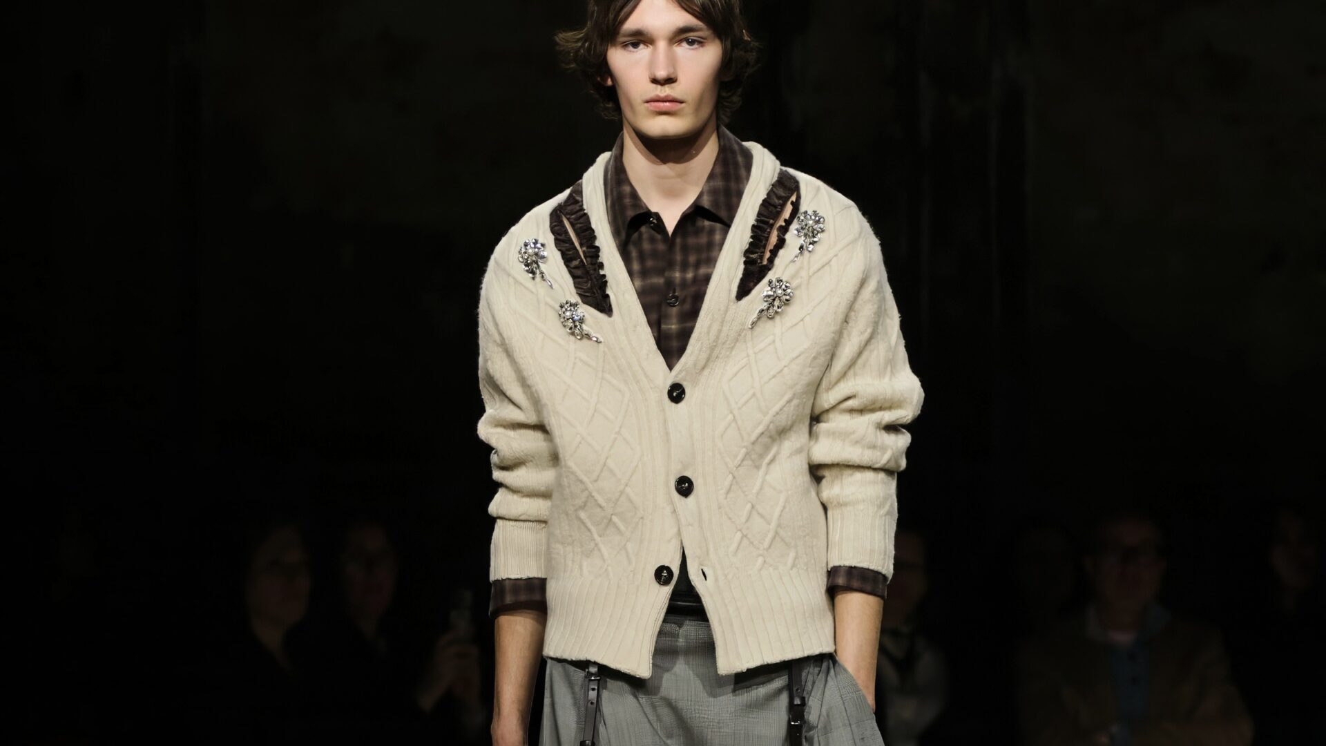 Runway shot of a male model walking Simone Rocha Autumn/Winter 2026 runway show at Alexandra Palace during London Fashion Week